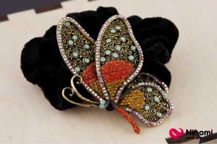 Резинка "Бронзовая бабочка с цветными камнями" на черном бархате - Фото